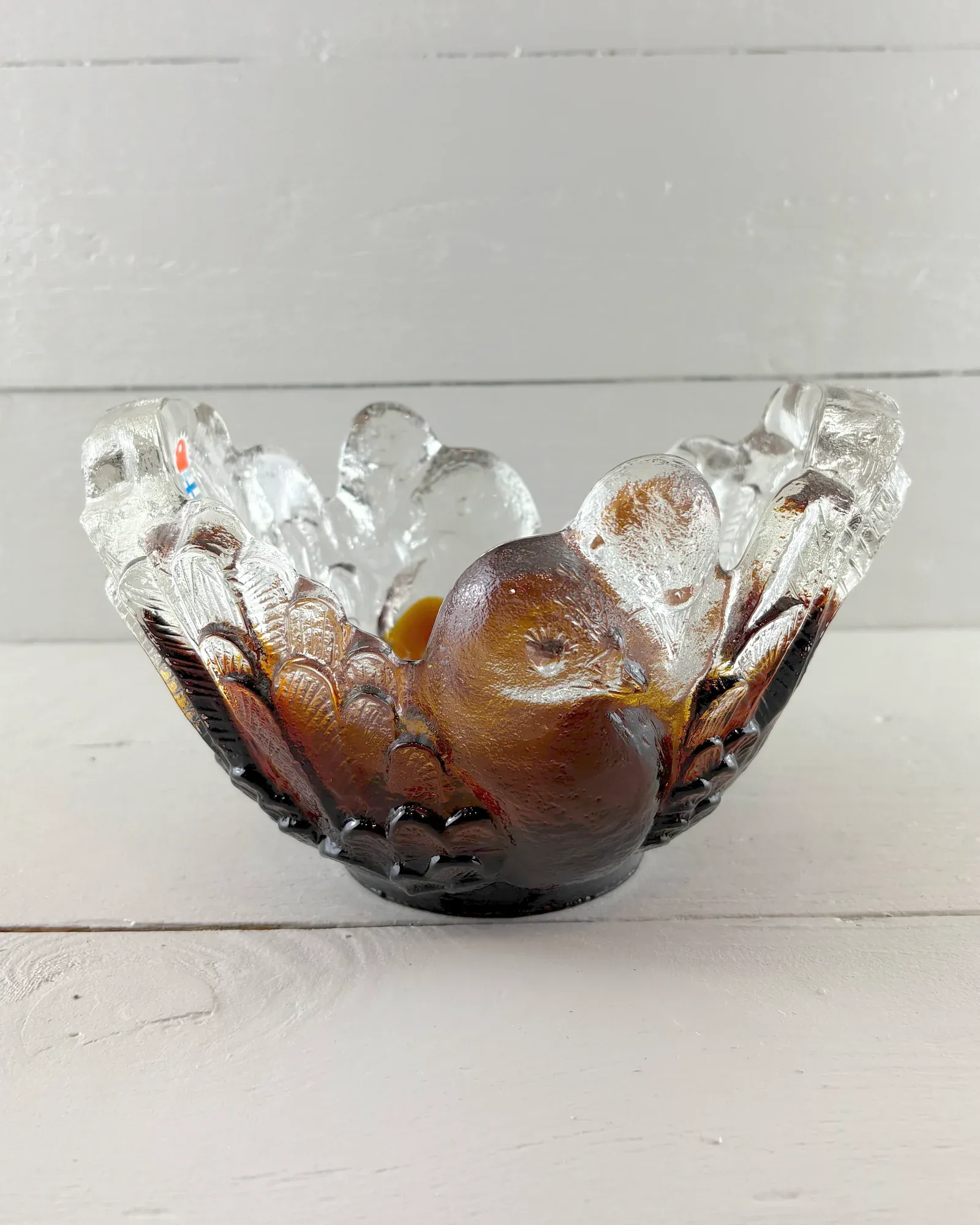 Kyyhky glass bowl by Pertti Santalahti for Kumela, front view with amber dove relief and clear feathered rim