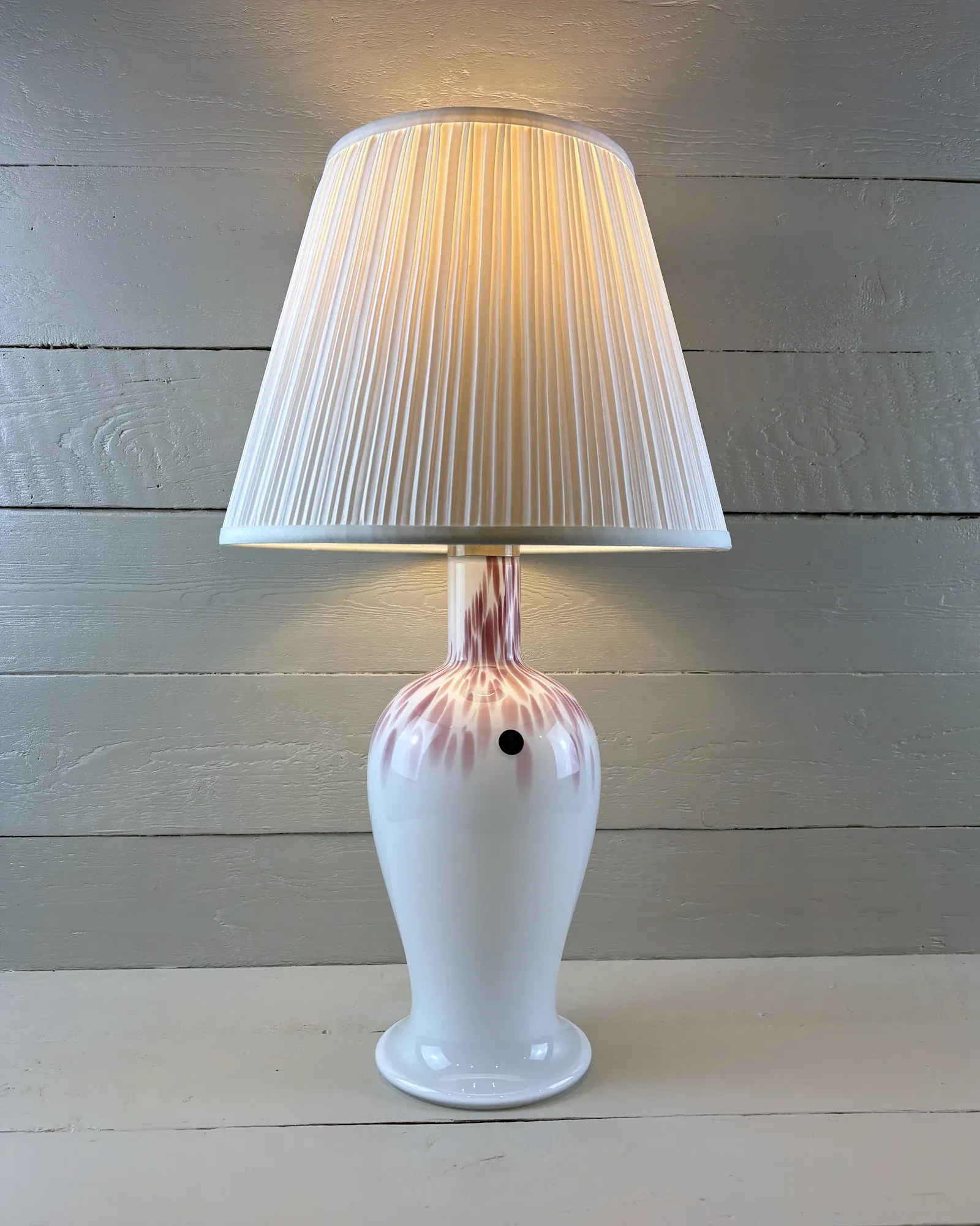 Danish Torino table lamp by Michael Bang for Royal Copenhagen in pink-streaked opal glass, front view, lit