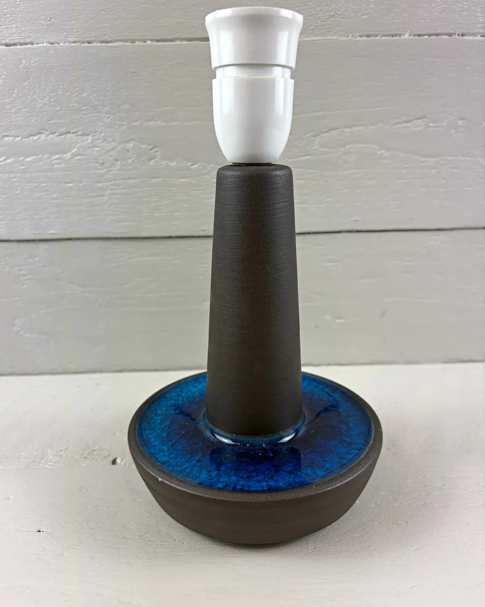 Danish Soholm 1072 stoneware table lamp with dark body and cobalt blue glazed bowl base, front view
