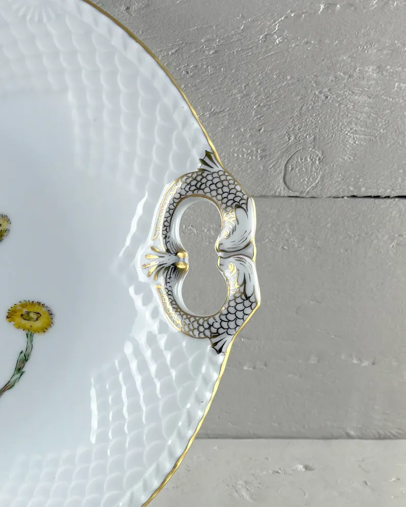 Fish-shaped handle of a Bing & Grondahl Seagull cake plate, painted with black scales and gilding