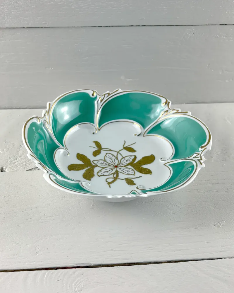 Graf von Henneberg porcelain dish seen from an angle, showing the shallow lobed bowl and low foot ring