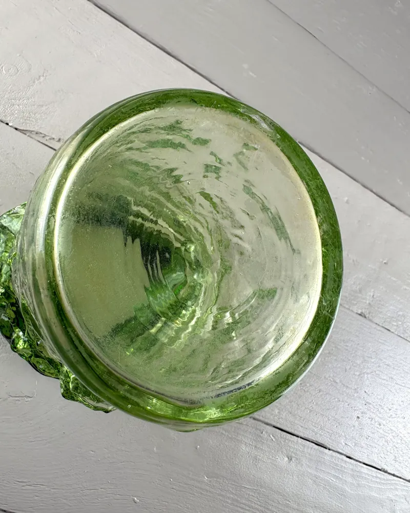 Base of the Kaj Blomqvist Pahka vase for Kumela: thick pale green glass with a rippled texture
