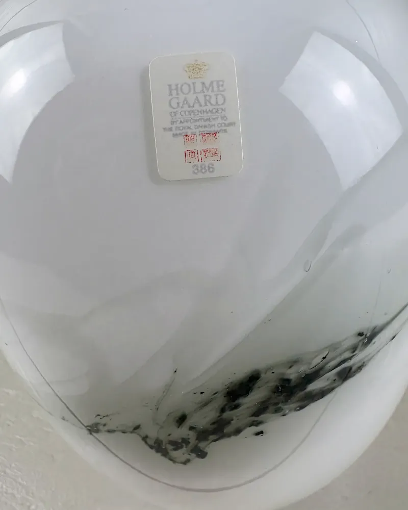 Close-up of the black and grey swirl inside the white glass of Michael Bang's Holmegaard Sakura lamp