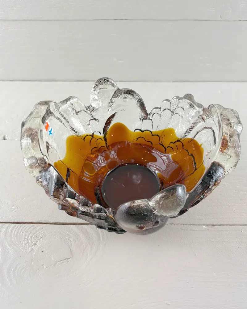 Interior of the Pertti Santalahti Kyyhky bowl, amber and brown glass flowing around a dark round centre