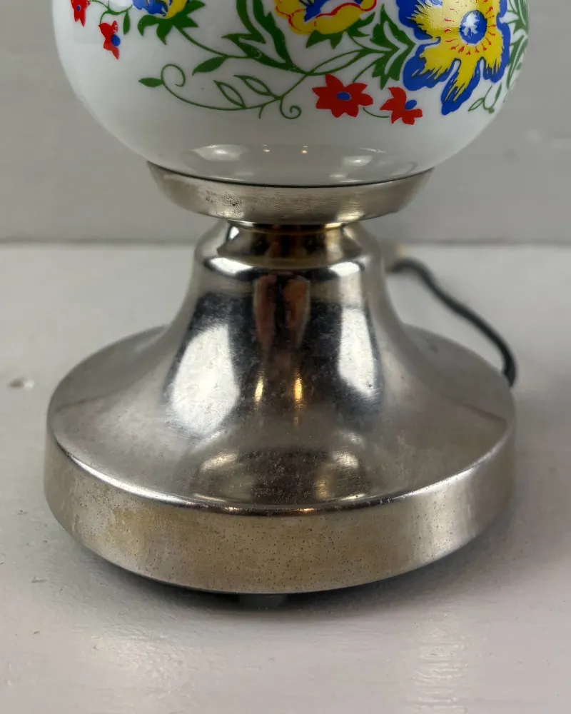 Plated metal base of the Polam lamp with patina and fine spots on the rim, collar and neck