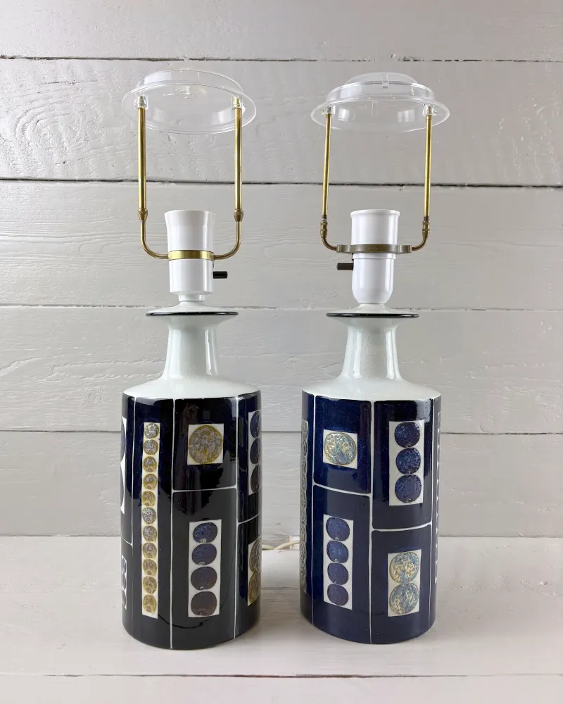 Two Danish Tenera ceramic lamp bases turned to show different hand-painted panels, brass and nickel fittings