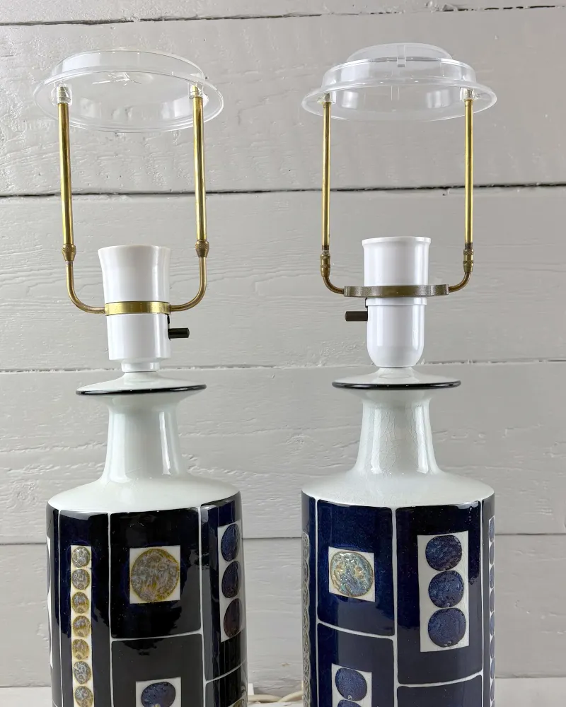 Top of two Tenera lamps: brass and nickel harness, clear acrylic diffuser, white socket and glazed neck