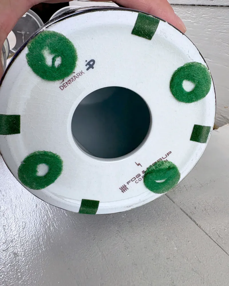 Underside of a Tenera lamp base with Denmark mark, printed Fog & Morup name and green felt pads
