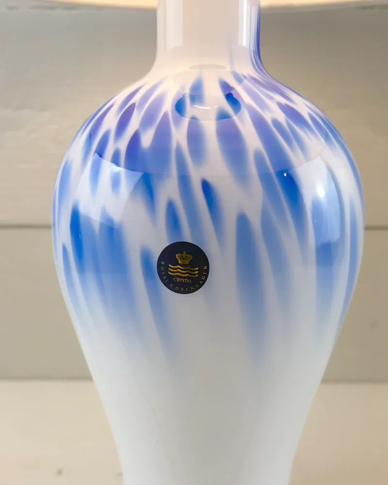 Cobalt blue streaks on the white cased opal glass body of the Torino Mellem lamp by Michael Bang