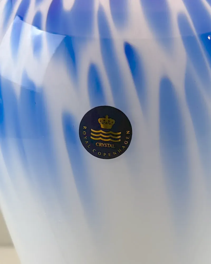 Black and gold Crystal Royal Copenhagen label with crown and three waves on the Torino opal glass lamp