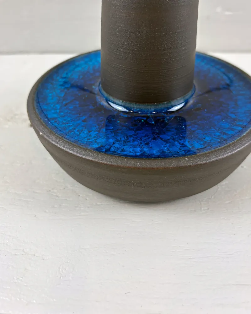 Close-up of cobalt blue crackle glaze pooled in the bowl-shaped foot of a Soholm 1072 lamp
