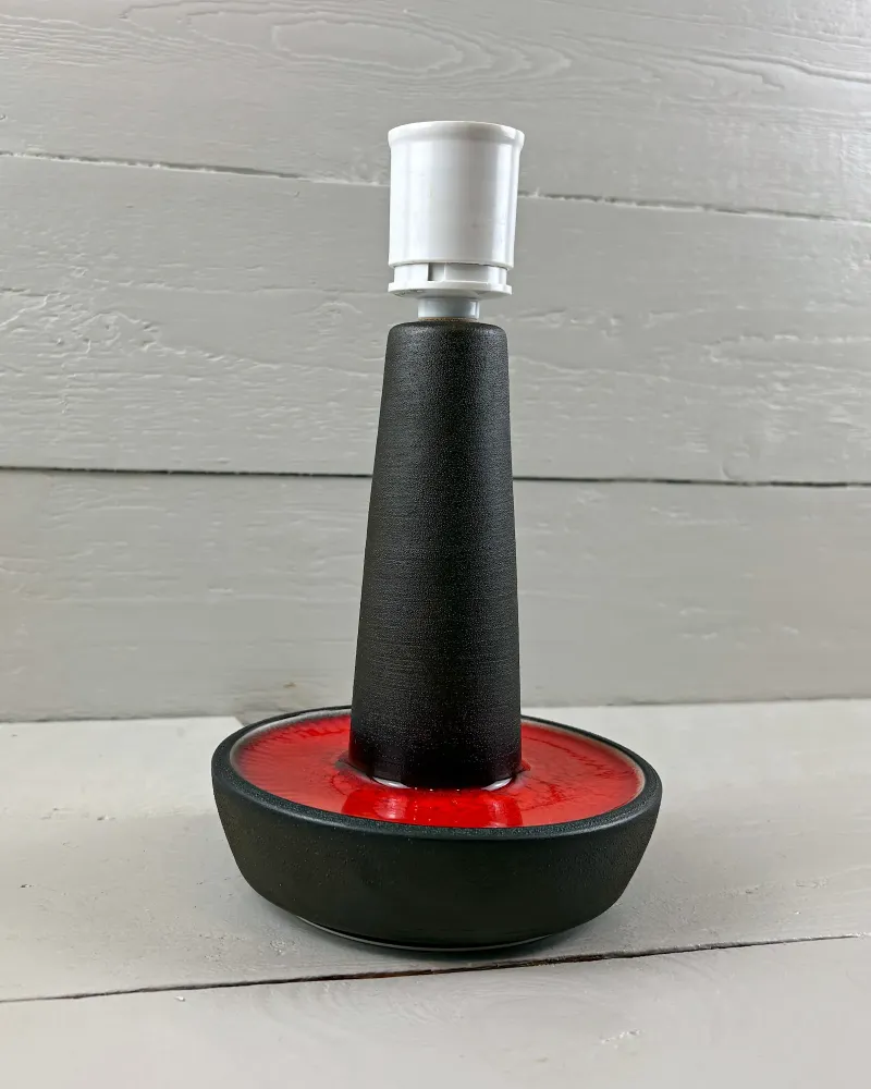 Soholm 1072 stoneware lamp base from slightly above, showing the red glaze dish around the dark stem