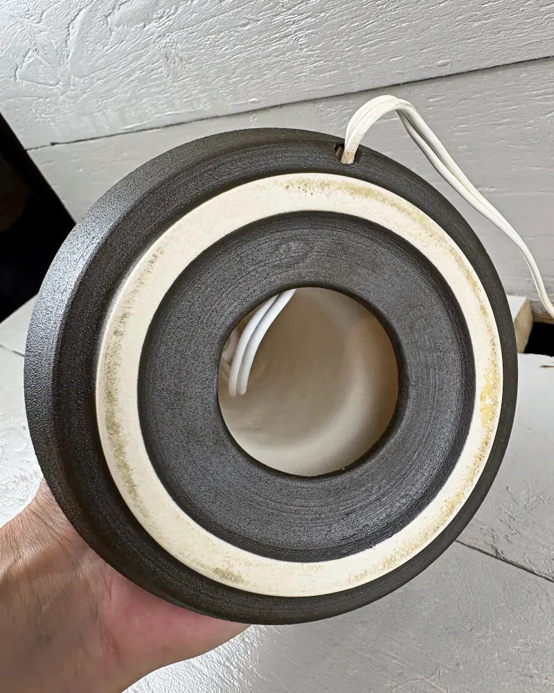 Soholm 1072 lamp foot ring seen from below, pale unglazed ceramic with light yellowish marks and cord notch