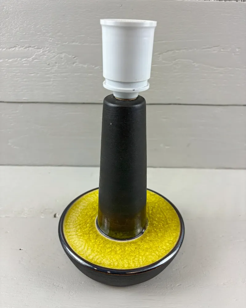 Soholm 1072 stoneware lamp from slightly above, showing the yellow glaze dish around the dark stem