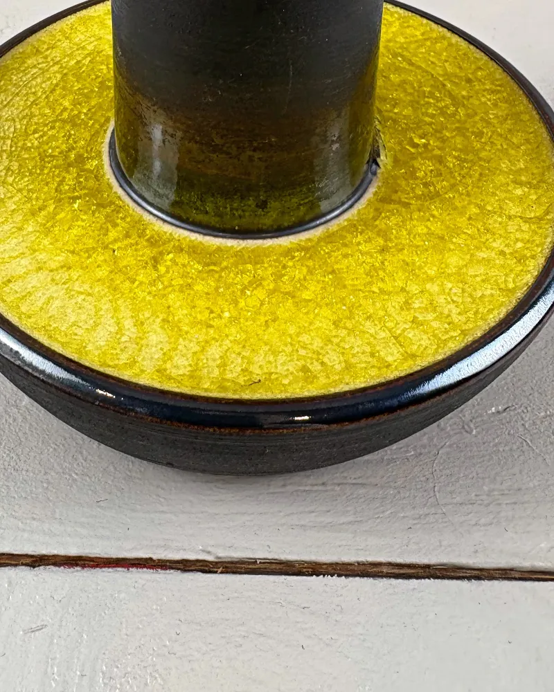 Detail of fine crackle in the yellow glaze, turning olive green where it pools around the stem of a Soholm lamp