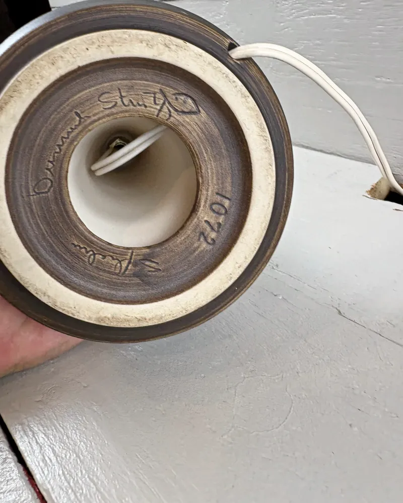Base of Soholm 1072 stoneware lamp with unglazed foot ring, incised markings and cord leaving the foot