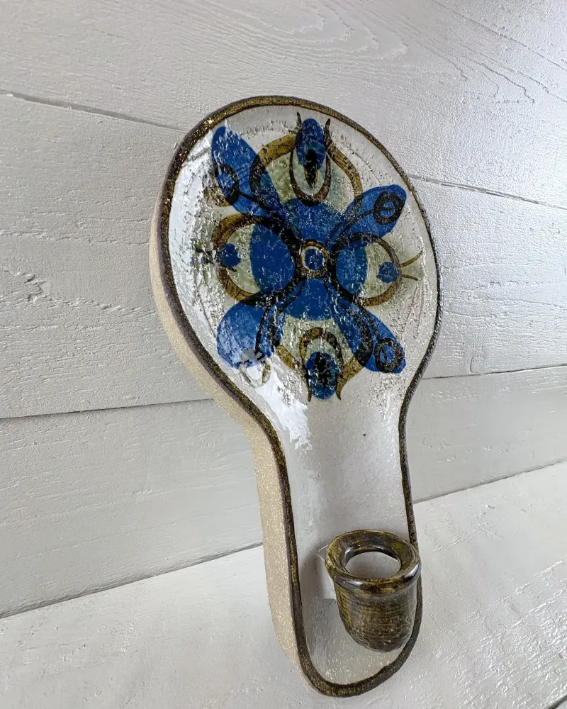 Soholm 3220 wall candle holder with cobalt blue flower decor on white glaze, three-quarter view