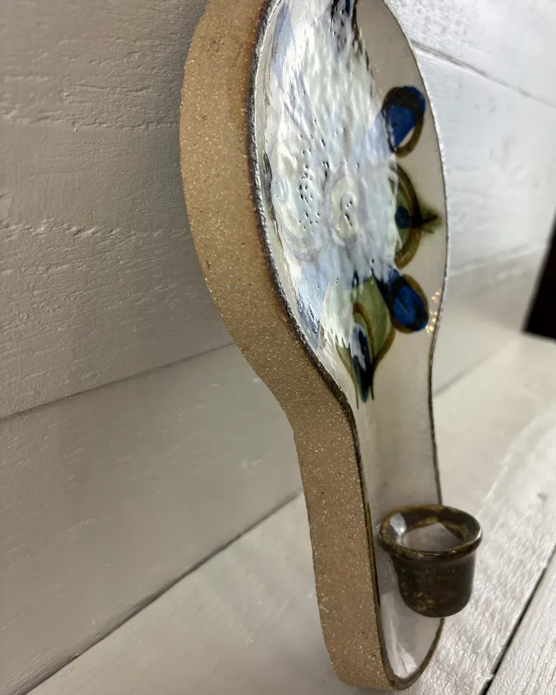 Side profile of Soholm 3220 wall candle holder showing unglazed stoneware edge and candle cup