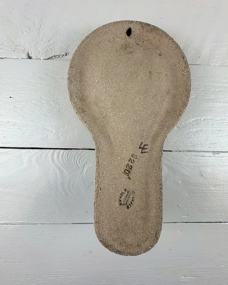 Unglazed back of Soholm 3220 wall candle holder with hanging hole, shape number and maker stamp
