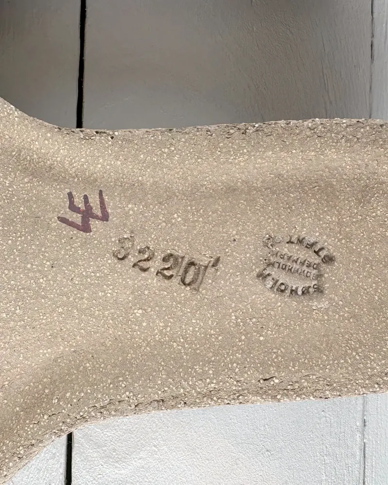 Close-up of Soholm Bornholm Denmark Stentoj stamp and impressed shape number 3220 on back