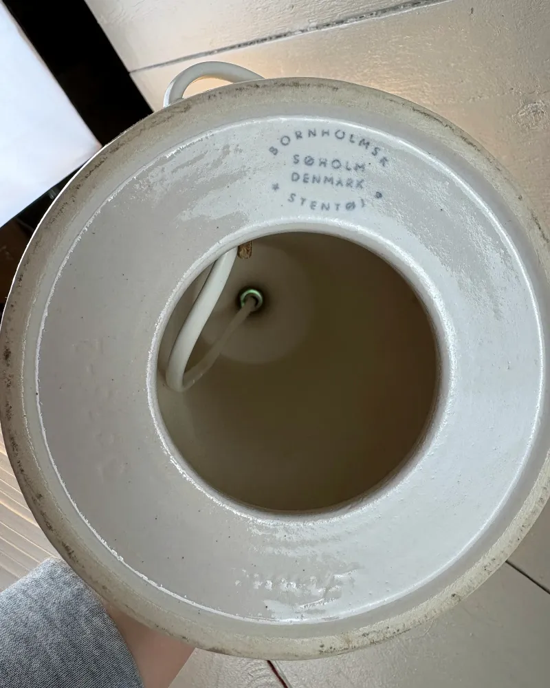 Open underside of a Danish Soholm stoneware lamp base with unglazed foot ring and maker's stamp