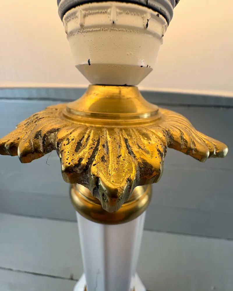 Pitted, aged surface of the brass leaves and chipped socket paint on a Soholm Heiberg lamp