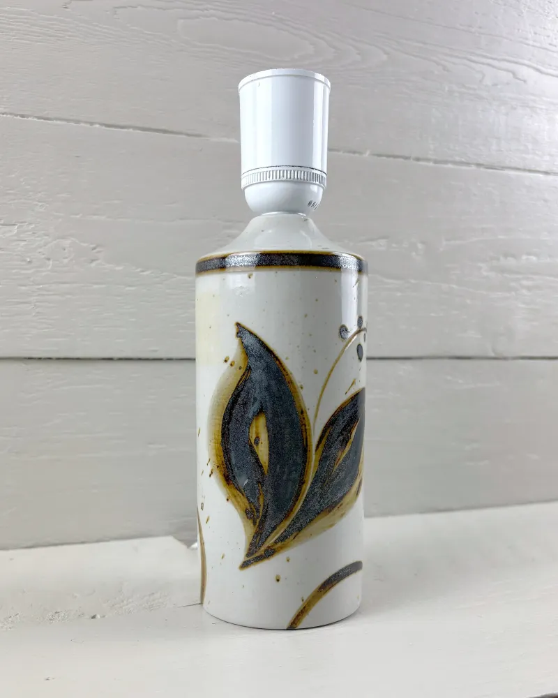 Soholm Lilia 1221 stoneware lamp base, three-quarter view of the blue and ochre painted leaves