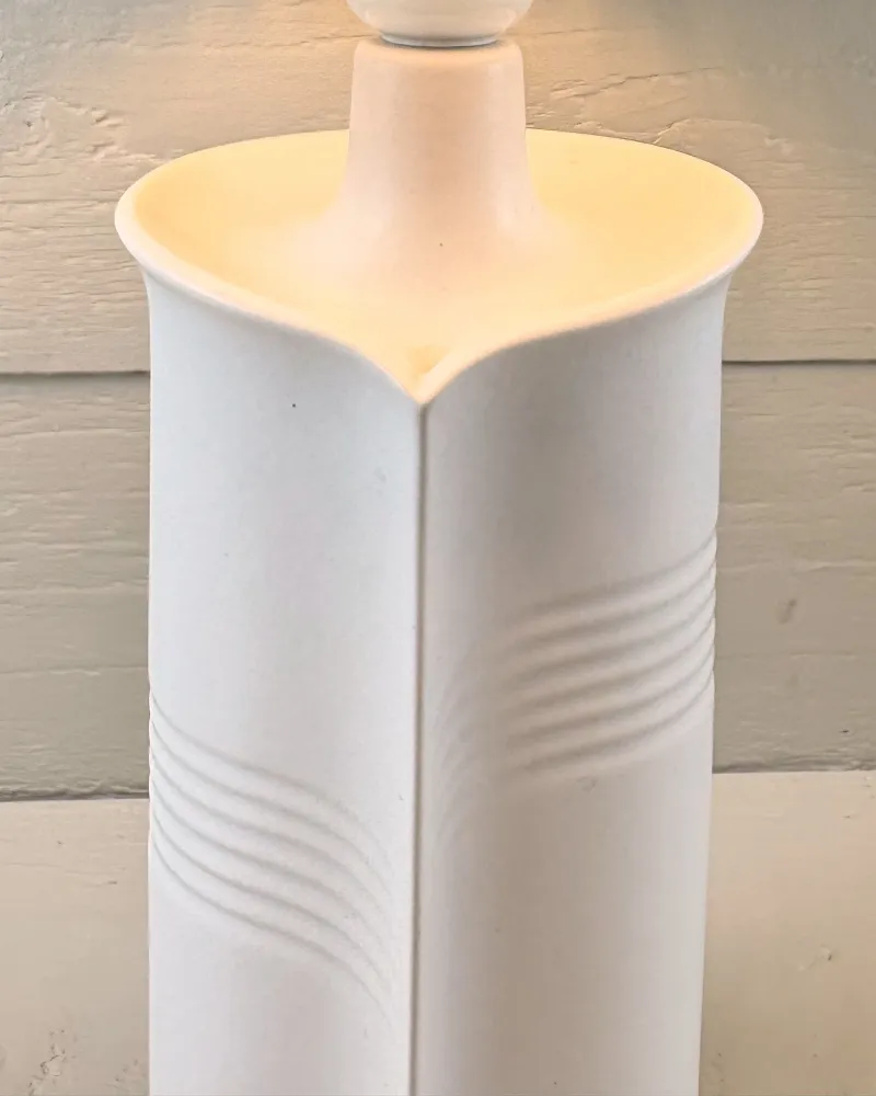 Detail of the flared heart-shaped rim and fine parallel grooves on the white Soholm lamp by Maria Philippi