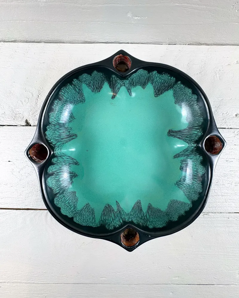 Top view of Upsala-Ekeby advent candle holder showing turquoise well and dark feathered glaze at the rim