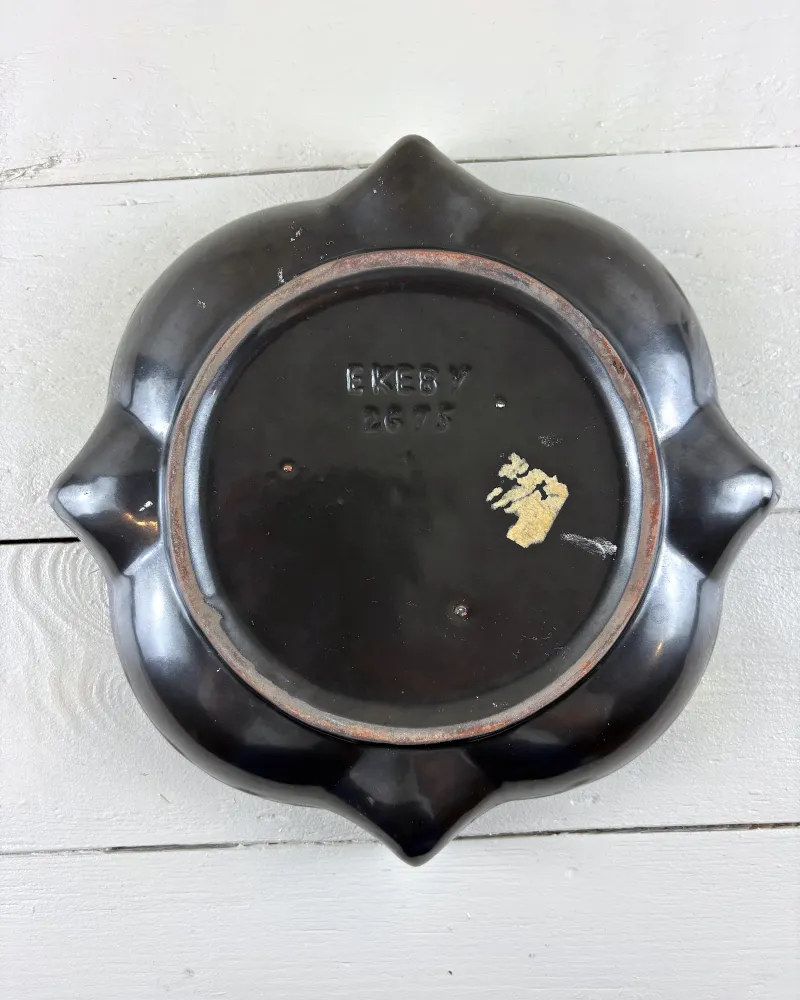 Black glazed base of Upsala-Ekeby advent candle holder with impressed mark and remains of a paper label